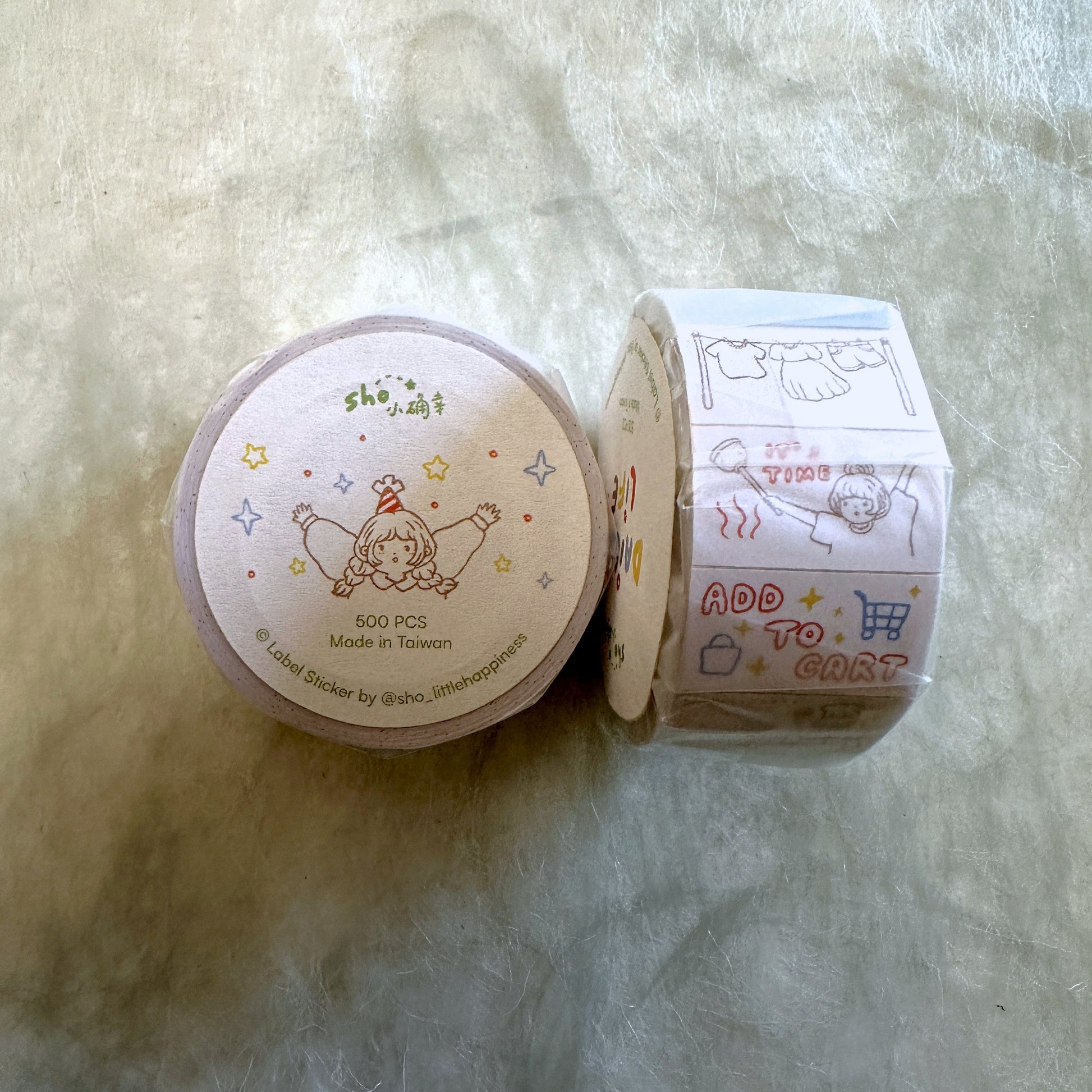 Roll of decorative stickers with cartoon designs on a textured surface